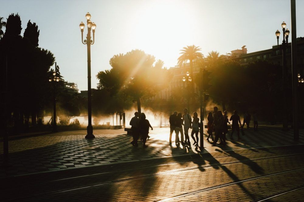 People walking in the sun in Nice, France